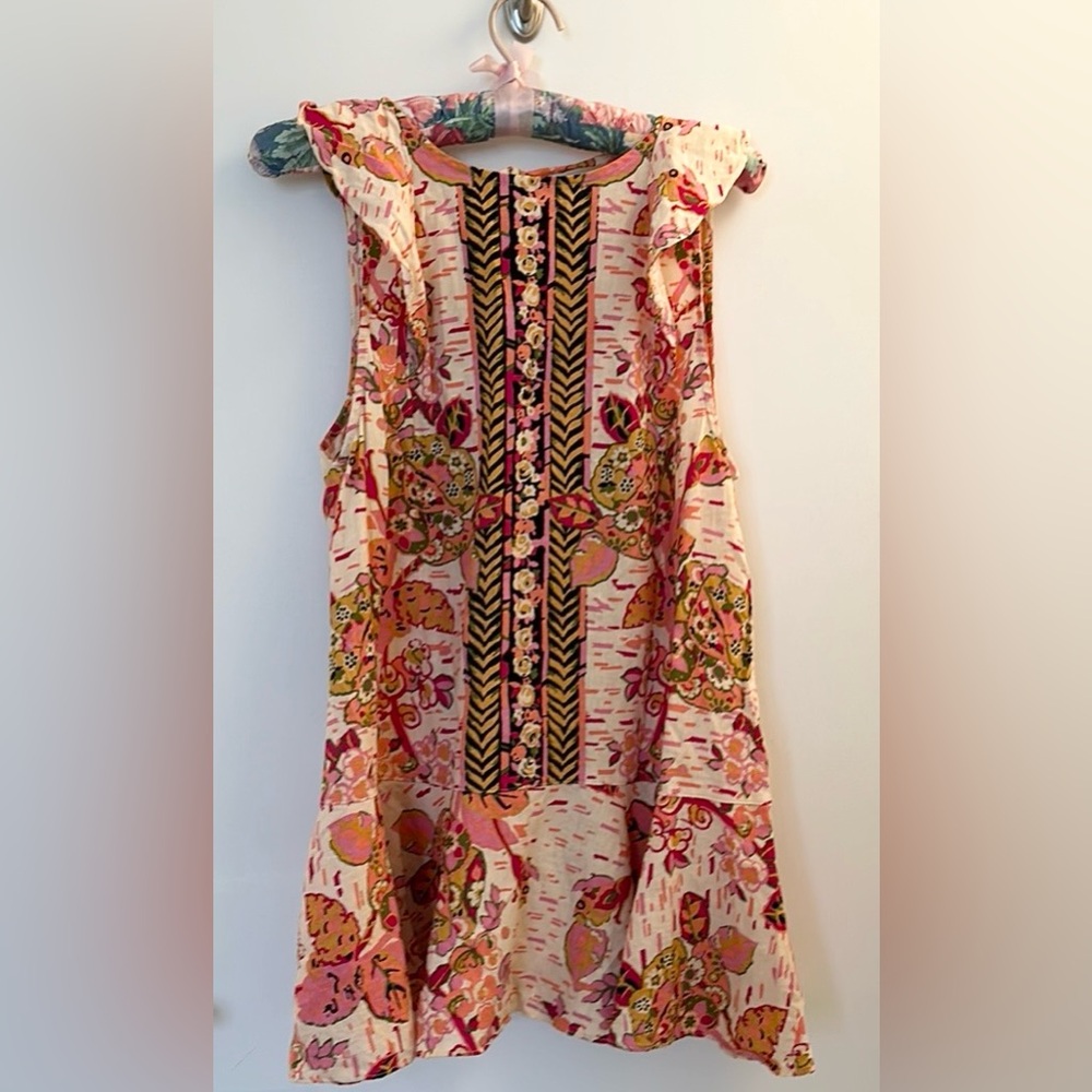 Free People Mini Dress. Size XS. Multi color. Open back. Ruffle hem.